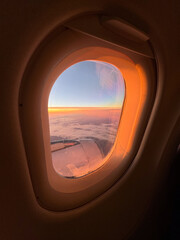 Sunset on a plane by the window seat