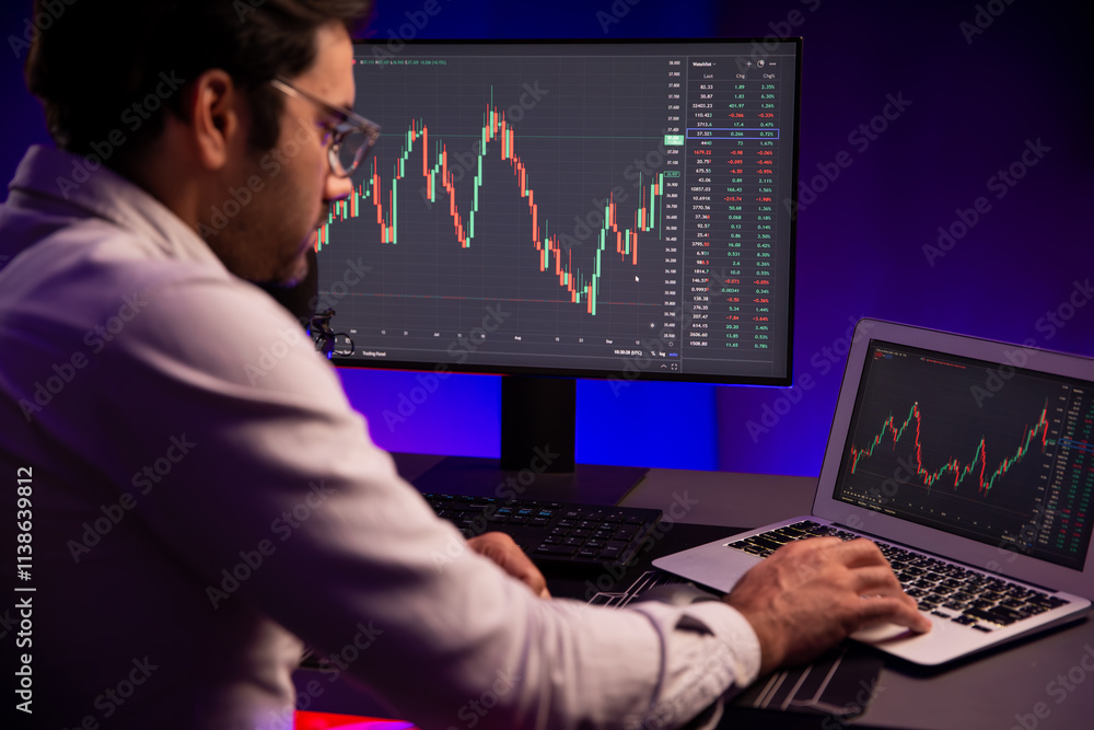 Poster smart trader businessman concentrating on dynamic stock exchange investment on pc and laptop showing