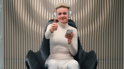Happy woman Caucasian girl lady in headphones listen music futuristic white neon background digital...
