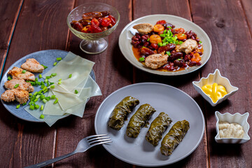 beans stewed with meat khinkal homemade and dolma with lamb homemade and sauce and hummus