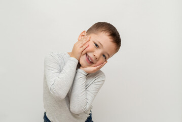 portrait of happy child on white background with space for text. little blue eyed boy with fair skin 5 years old