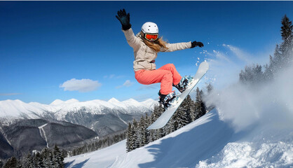 Snowboarde performing tricks jumping through air with deep blue sky in background sporty tourist snowboarding in the sunny day performs trick flying off 