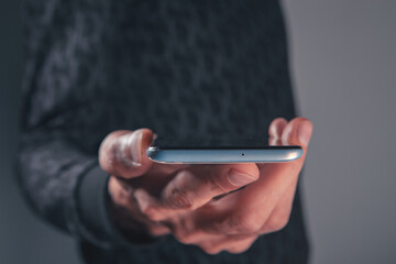 close up of a man using mobile phone,