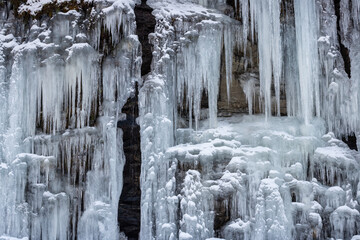 Natural icicles on a stone wall, Norway