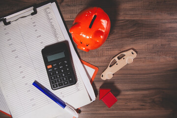 office table with computer, calculator and pen.