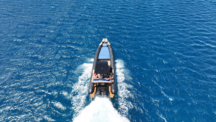 Aerial drone top down photo of  luxury inflatable rib speed boat cruising in mediterranean sea