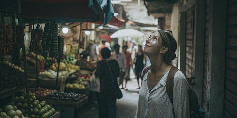 Obraz premium Young Woman Exploring a Vibrant Market with Fresh Produce and Unique Goods