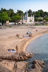 Scenic Spanish Coastal View with Rocky Shoreline and Villas Mediterranean Landscape.coastline, featuring rocky shores, traditional Mediterranean villas, and lush greenery against a clear blue sky. 