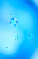 Vertical Abstract Blue Water Bubbles with Light Reflections