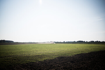 plowed field at sunset