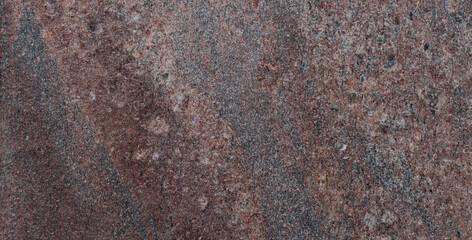 Close-up of a textured stone background in oxidized color