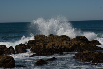 waves crashing on rocks