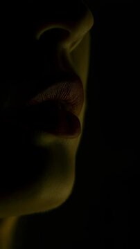 Mysterious Silhouette of Lips in Low Light with Branding Overlay