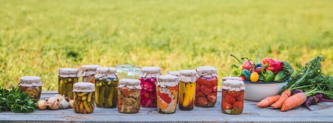 canning vegetables in jars. Selective focus