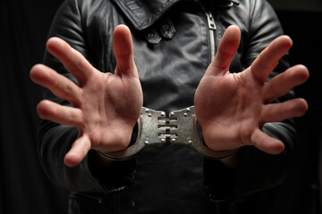 Hands in handcuffs. Crime arrest and jail concept