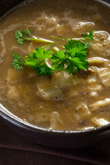 Hot mushroom soup with noodles. Small depth of field.