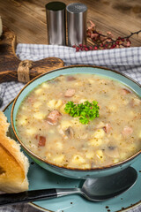 Traditional polish soup Zurek in ceramic bowl.