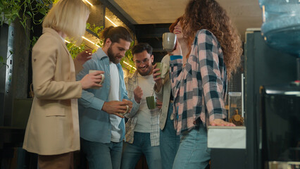 Diverse men women freelancers coworkers dancers friends happy joyful girls guys male female dance music business team office colleagues dancing in bar coworking celebrate corporate party coffee break
