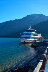 Beautiful landscape of lake Achen on a sunny day with pleasure boat. Austria, Tirol.