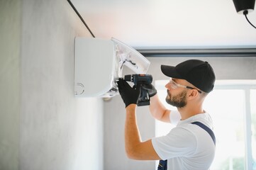 Repairman fix air conditioning systems, Male technicians service for repair and maintenance of air...