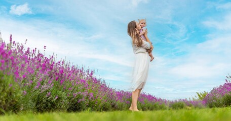 Happy mother and daughter in a lavender field