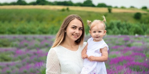 Happy mother and daughter in a lavender field