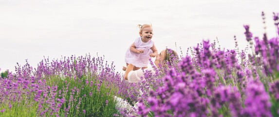 Happy mother and daughter in a lavender field