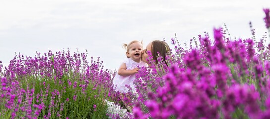 Happy mother and daughter in a lavender field