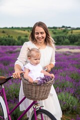 Happy mother and daughter in a lavender field