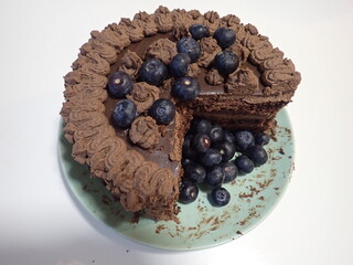 sweet decorated chocolate cake with blueberries