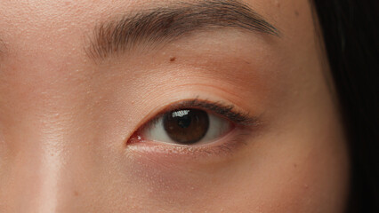Extreme close up female dark eyes details Asian woman girl korean chinese ethnic healthy japanese...