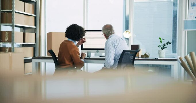 Men, computer and together for distribution, boxes and discussion for delivery schedule in office at warehouse. People, mentor and conversation with back, package and logistics with supply chain job