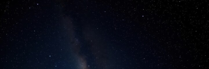 Night sky filled with twinkling stars against a dark background, milky way, stars, astronomy