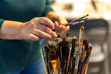 hands of artist with brushes