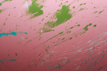 Color splashes on a pink wall texture and abstraction for interior and banner