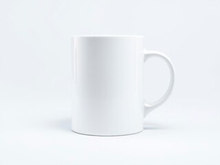 Obraz premium Blank white ceramic mug with a curved handle and glossy finish on a white background, kitchenware, product presentation