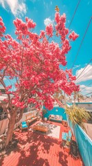 Obraz premium A vibrant outdoor space featuring a blooming tree and cozy seating area.