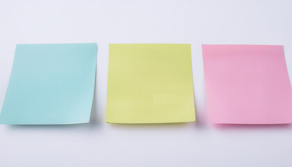 Three empty sticky notes on white background. Blank paper for message. Mock-up. Close-up.