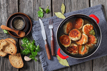turkey potato cakes in a red pot, top view
