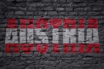 painted national flag with text austria on a old brick wall