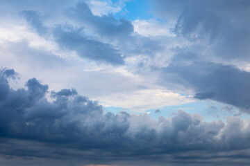 Dramatic cloud formation over horizon during early evening hours
