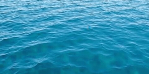 Blue water wave texture background resembling a serene ocean surface with gentle waves, ocean, surface, marine