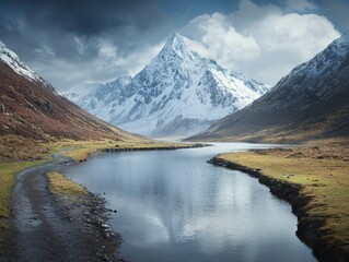 Majestic snow-capped mountain reflecting in a tranquil river amidst nature.