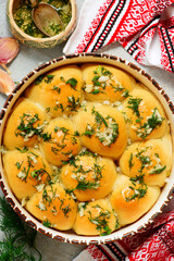 Traditional Ukrainian pampushki with borsch.style rustic