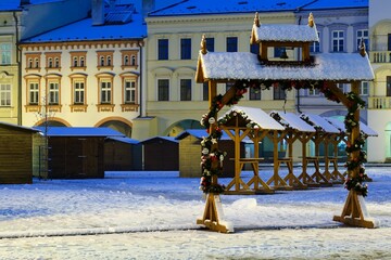 Snow-covered square with sales stands before Christmas at dawn. Novy Jicin. Czech Republic.