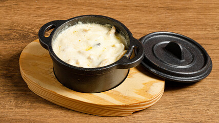 Creamy chicken stew in pot