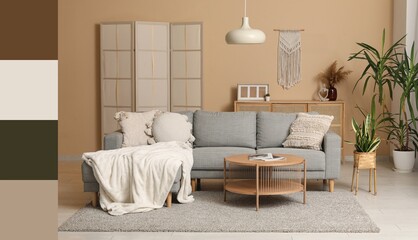 Modern interior of living room with grey sofa. Different color patterns