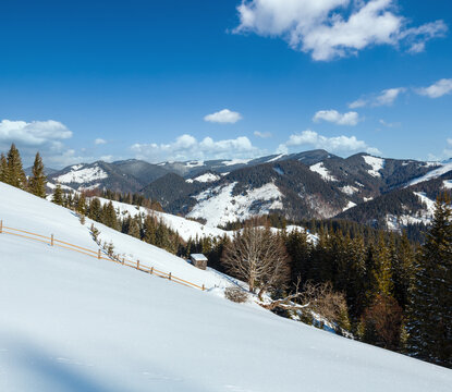 Winter mountain rural snow covered hill slope