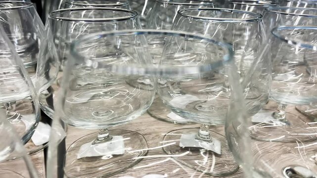 Empty Wine Glasses on Store Shelf, New Crystal Glassware Display in Kitchenware Shop Close Up Shot