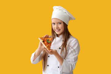 Cute little happy chef with piece of tasty pizza on yellow background